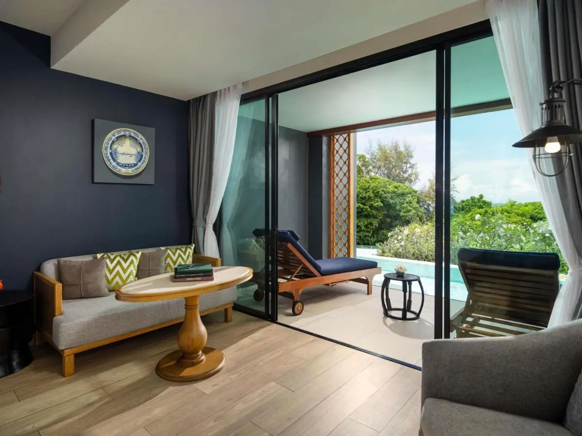 Indoor Outdoor Seating Area with Pool and Lounge Chairs at Karon Beach