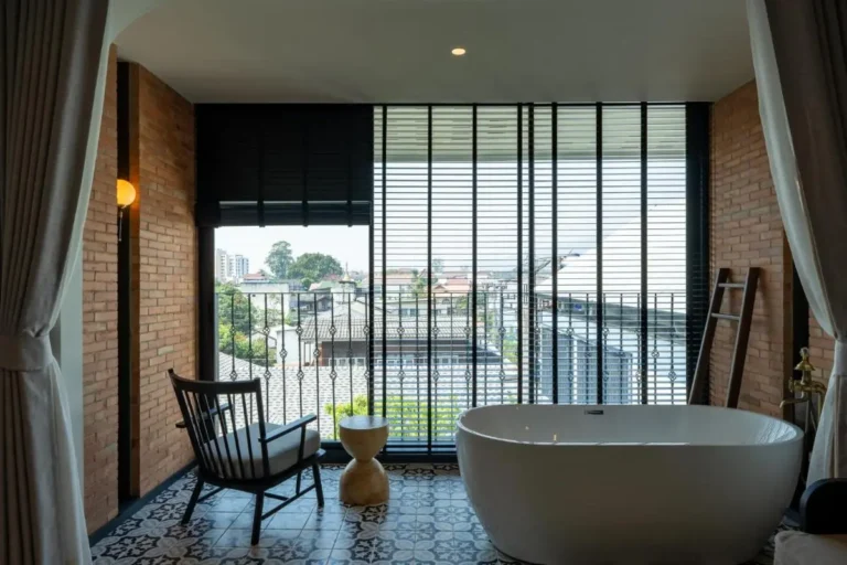 Indoor Oval Bathtub with Urban View and Exposed Brick Walls in Phra Sing Chiang Mai