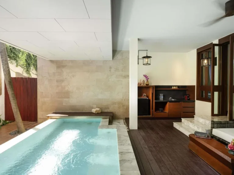 Indoor Pool and Spa Area with Wooden Deck and Jacuzzi Seating at Patong Beach