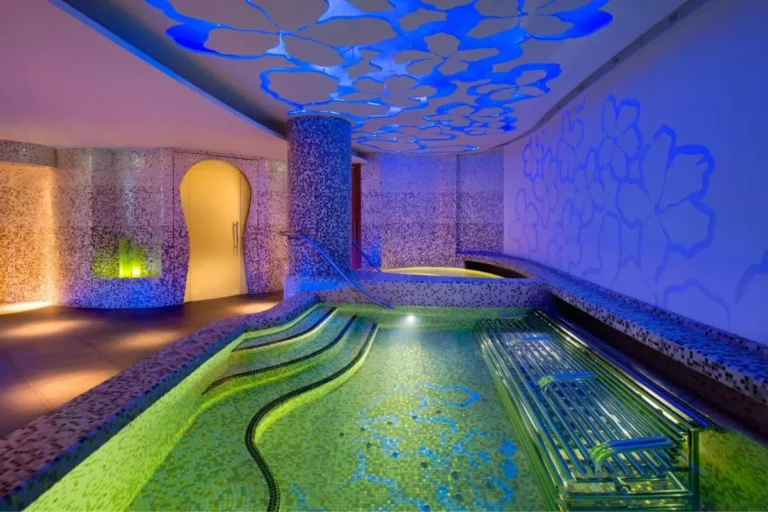 Indoor Pool Area with Hydrotherapy Seating and Mosaic Tiles in Sentosa Island