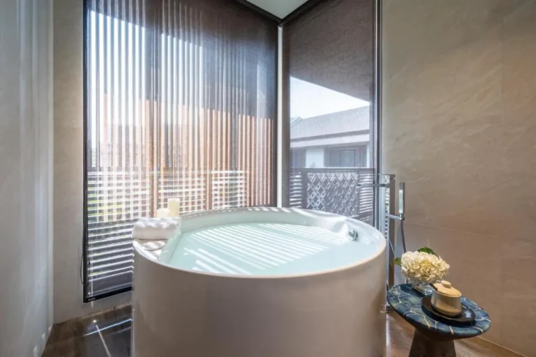 Indoor Soaking Tub with Natural Light and Minimalist Decor in Chang Khlan Chiang Mai