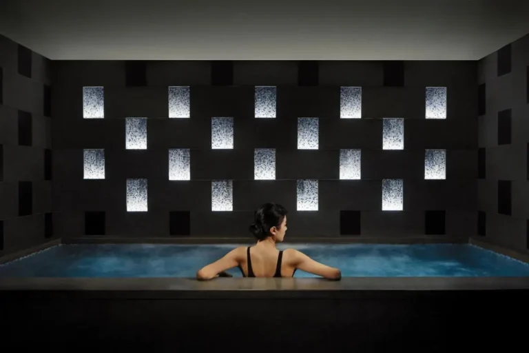 Indoor Spa Pool with Illuminated Wall and Relaxation Area in Marina Bay