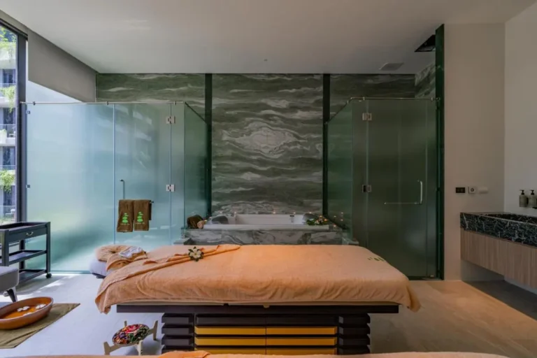 Indoor Spa Room with Jacuzzi and Massage Table Featuring Natural Light at Bang Tao Beach