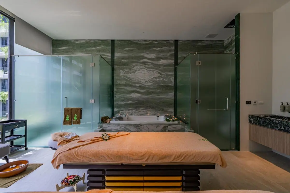Indoor Spa Room with Jacuzzi and Massage Table Featuring Natural Light at Bang Tao Beach
