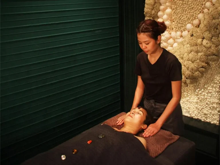 Indoor Spa Room with Massage Table and Stone Therapy in Khlong Toei Wellness Center