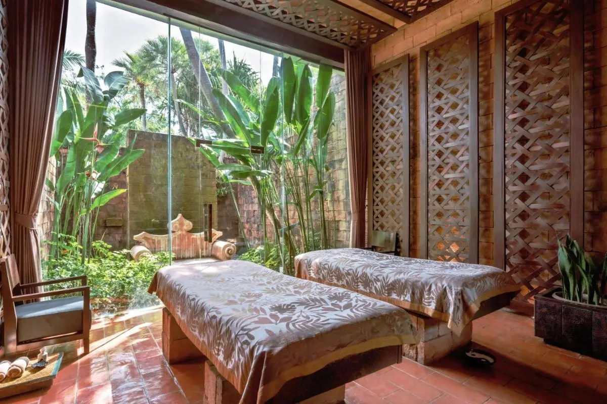 Indoor Spa Room with Massage Tables and Tropical Garden View at Mai Khao Beach