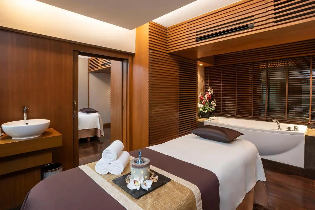 The Landmark Bangkok Indoor Spa Treatment Room with Massage Table and Bathtub in Khlong Toei Wellness Center