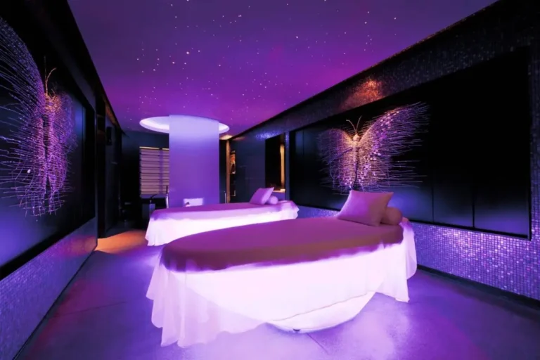 Indoor Spa Treatment Room with Massage Tables and Ambient Purple Lighting in Bang Rak