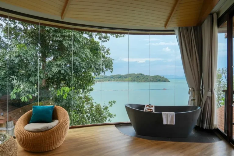 Indoor Space Featuring Modern Black Bathtub with Scenic Water View in Phuket Town