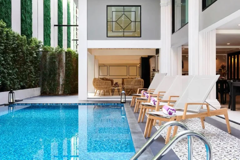 Indoor Swimming Pool with Lounge Chairs and Vertical Garden in Phra Nakhon Area