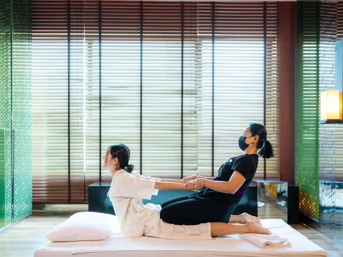 Renaissance Bangkok Ratchaprasong Hotel by Marriott Indoor Thai Massage Room with Wooden Panels and Natural Light in Pathumwan