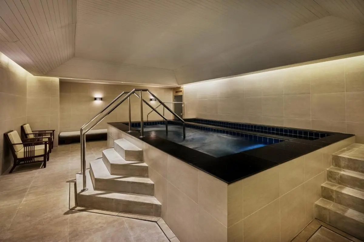 JW Marriott Hotel Bangkok Indoor Wellness Area with Elevated Spa Pool and Relaxation Seating in Khlong Toei Bangkok