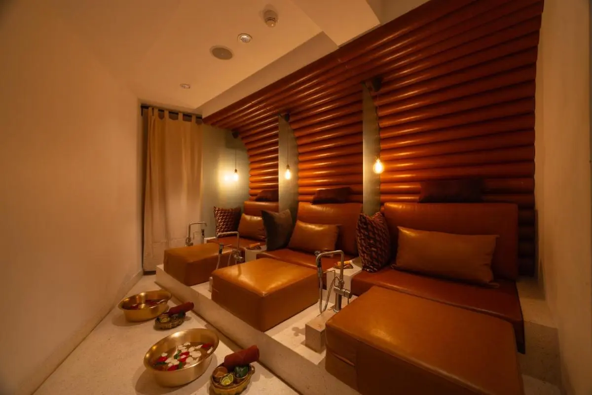 LiT BANGKOK Hotel Indoor Wellness Area with Foot Soaking Basins and Leather Chairs in Pathumwan