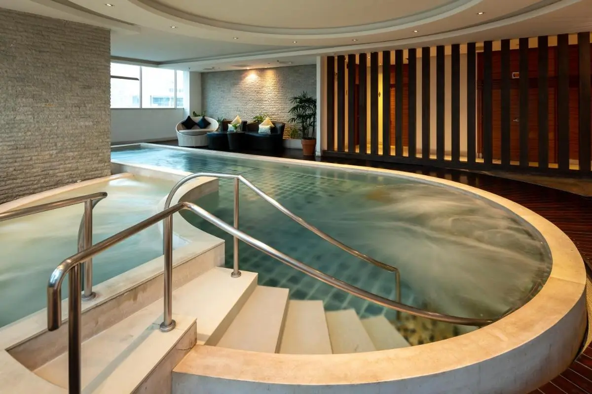 Jasmine Resort Bangkok Indoor Wellness Area with Jacuzzi and Lap Pool Featuring Modern Seating in Wattana Bangkok
