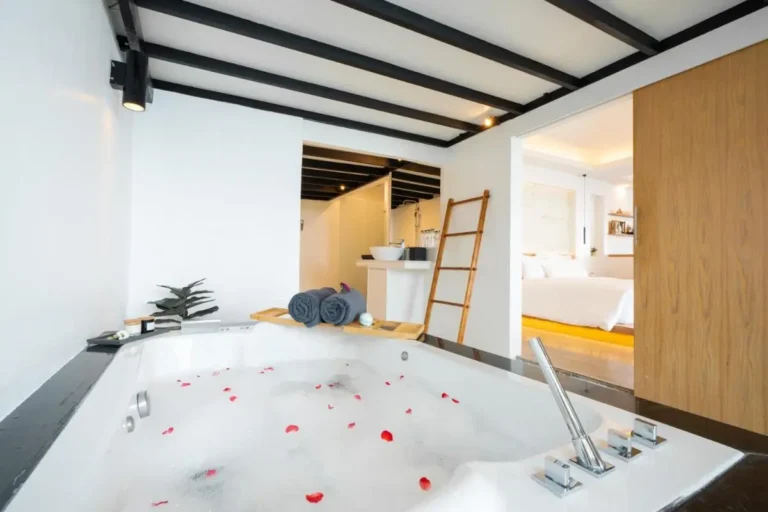 Indoor Wellness Area with Jacuzzi Tub and Relaxing Bedroom at Karon Beach