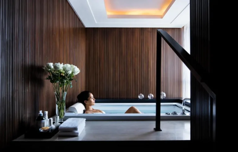 Indoor Wellness Area with Marble Tub and Wooden Slat Walls in Wattana Bangkok