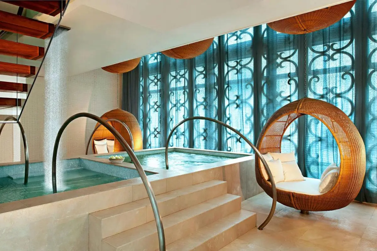 The St. Regis Bangkok Indoor Wellness Area with Pools and Relaxing Lounge Chairs in Pathumwan Bangkok