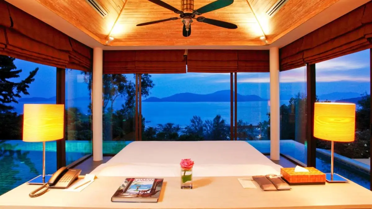Indoor Wellness Room with Massage Table Overlooking Panwa Beach Pool and Natural Landscape
