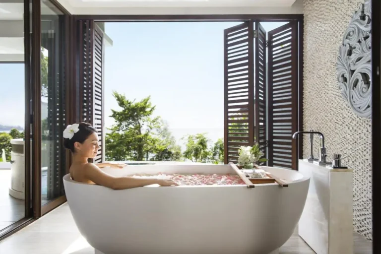 Indoor Wellness Space Featuring Freestanding Bathtub with Scenic Nai Thon Beach View