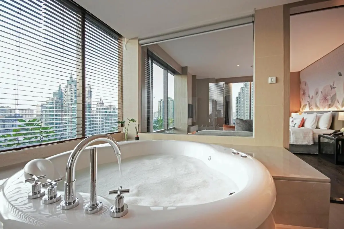 Bangkok Indoor Whirlpool Bathtub and Bedroom with City View in Pathumwan Urban Setting