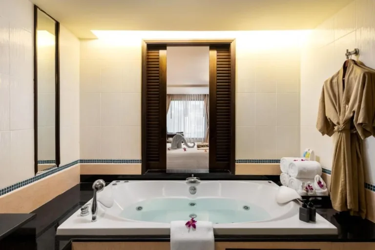 Indoor Whirlpool Bathtub with Jets and Adjacent Bedroom View at Patong Beach