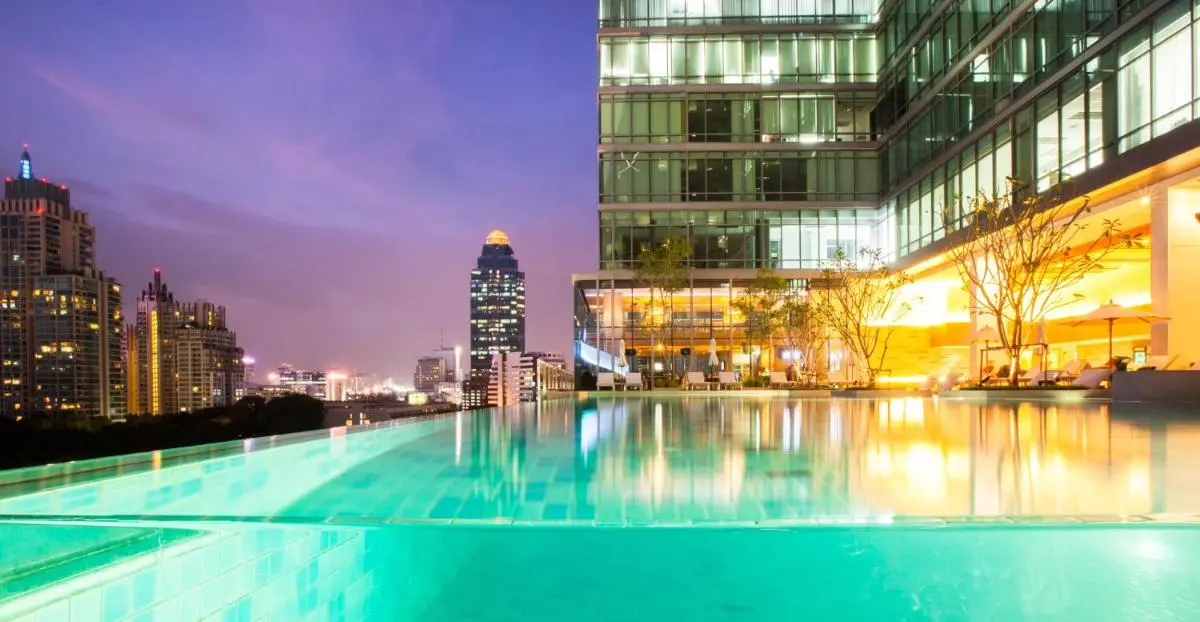 Sivatel Bangkok Hotel Infinity Pool and Relaxation Area with Cityscape Views in Pathumwan Bangkok