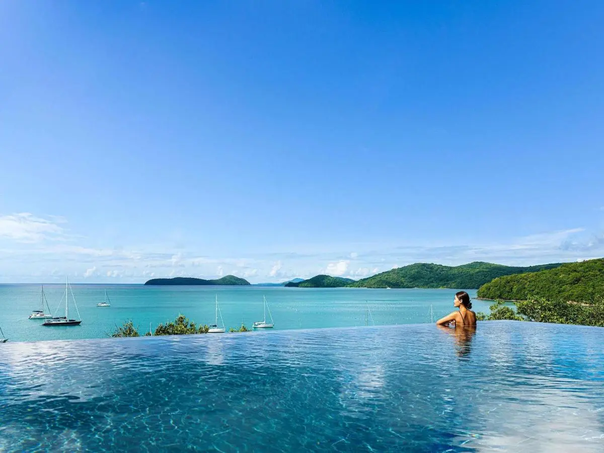 Infinity Pool Overlooking Calm Turquoise Ocean and Forested Islands at Panwa Beach