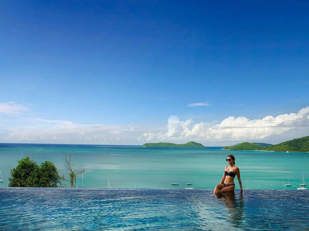 Infinity Pool Overlooking Turquoise Ocean and Forested Islands at Panwa Beach