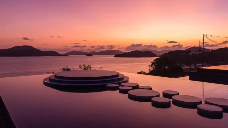Infinity Pool with Circular Stone Platforms at Panwa Beach Sunset View