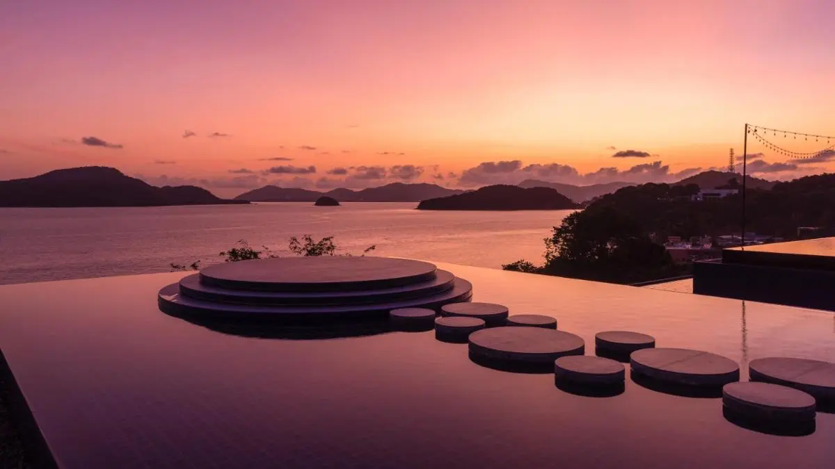 Infinity Pool with Circular Stone Platforms at Panwa Beach Sunset View