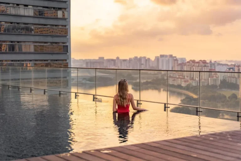 Infinity Pool with Cityscape and Waterfront Views on High-Rise Terrace Singapore