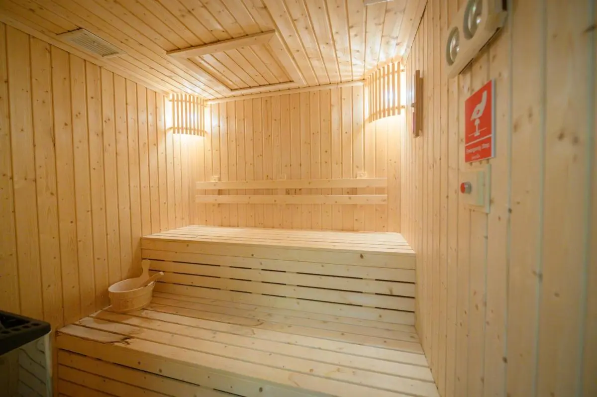 Chiang Mai Province Interior View of a Wooden Sauna Room with Benches and Heater in Chang Khlan Chiang Mai