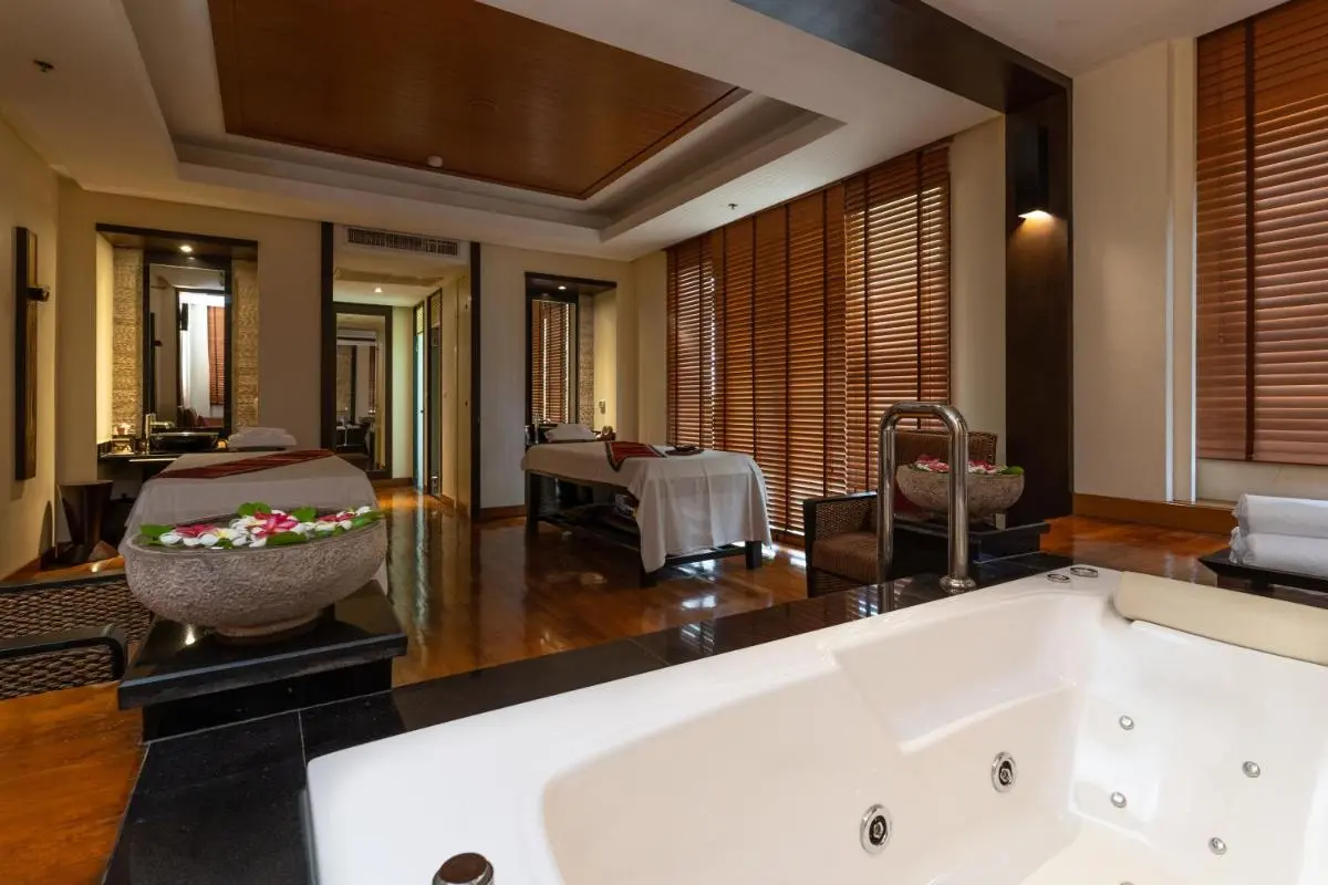 Interior Wellness Spa Room with Jacuzzi Tub and Dual Massage Tables at Panwa Beach