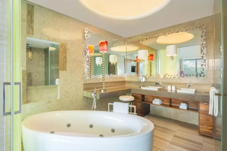 Jacuzzi Tub and Vanity Area with Mirror and Lighting in Sentosa Island Bathroom
