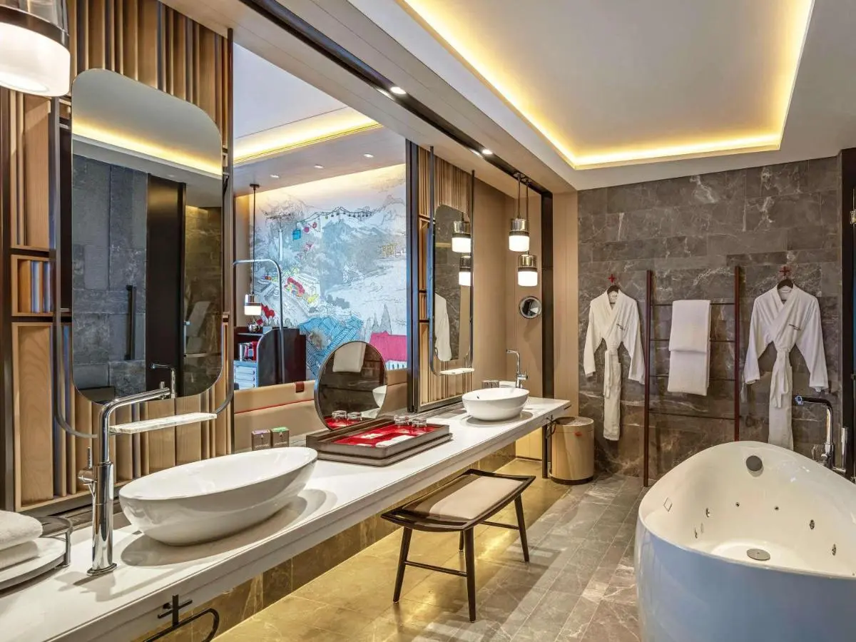 Swissotel The Stamford Singapore Jacuzzi Tub and Wellness Bathroom Features Near City Hall with Stone and Wood Accents