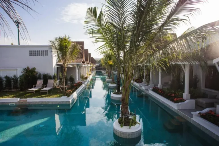 Long Narrow Swimming Pool with Palm Trees and Garden Areas in Thalang