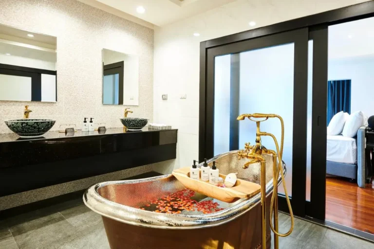 Luxurious Bathroom with Freestanding Metallic Bathtub and Spa Features in Phra Nakhon