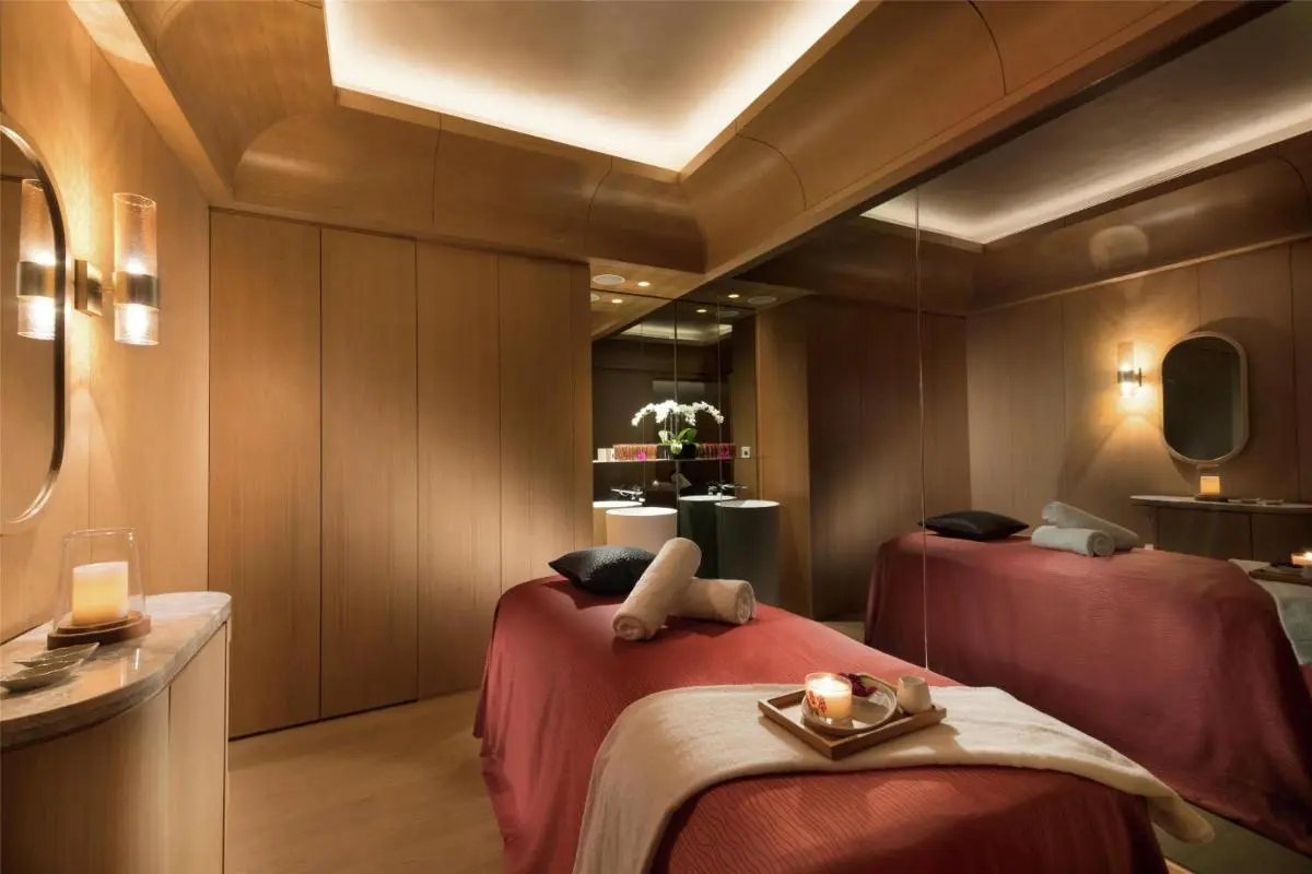 Massage Room with Wooden Interior and Soft Lighting in Marina Bay