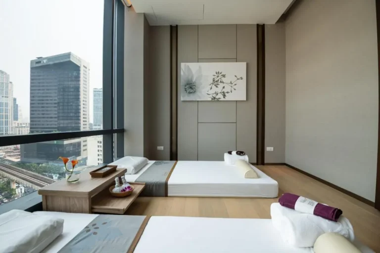 Minimalist Spa Treatment Room with Massage Beds and Urban Views in Wattana Bangkok