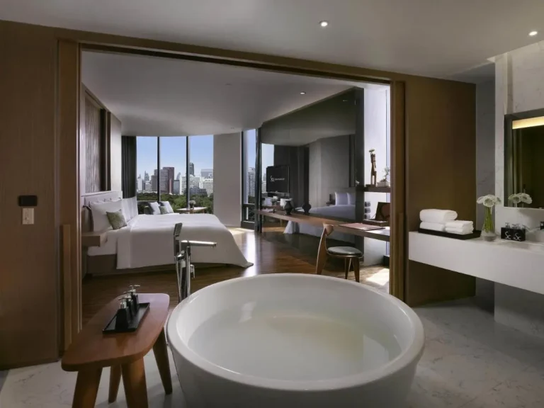 Modern Bang Rak Suite Featuring Freestanding Bathtub and Panoramic City Views