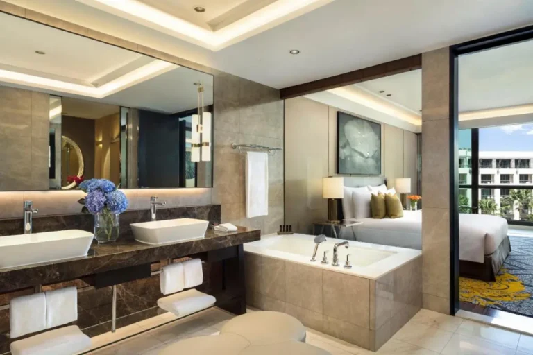 Modern Bathroom and Bedroom Design Featuring Built-In Bathtub and Double Vanity in Pathumwan