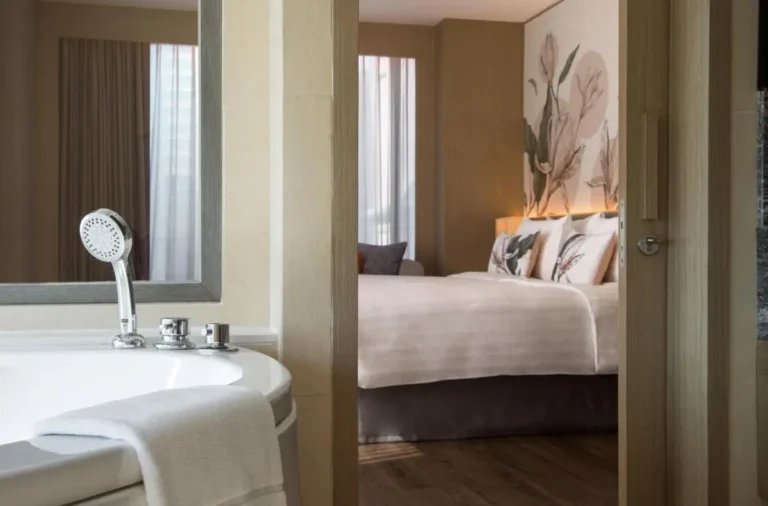 Modern Bathroom and Bedroom Interior with Bathtub and Botanical Decor in Pathumwan