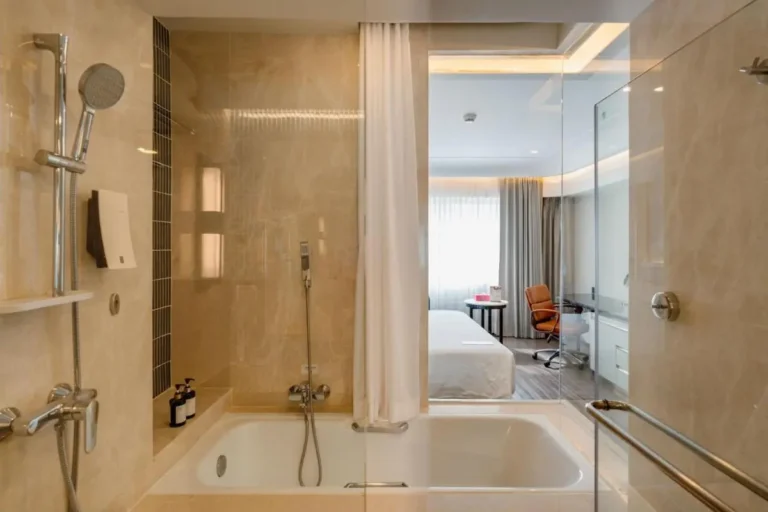 Modern Bathroom and Bedroom Interior with Bathtub and Glass Partition in Bang Kho Laem