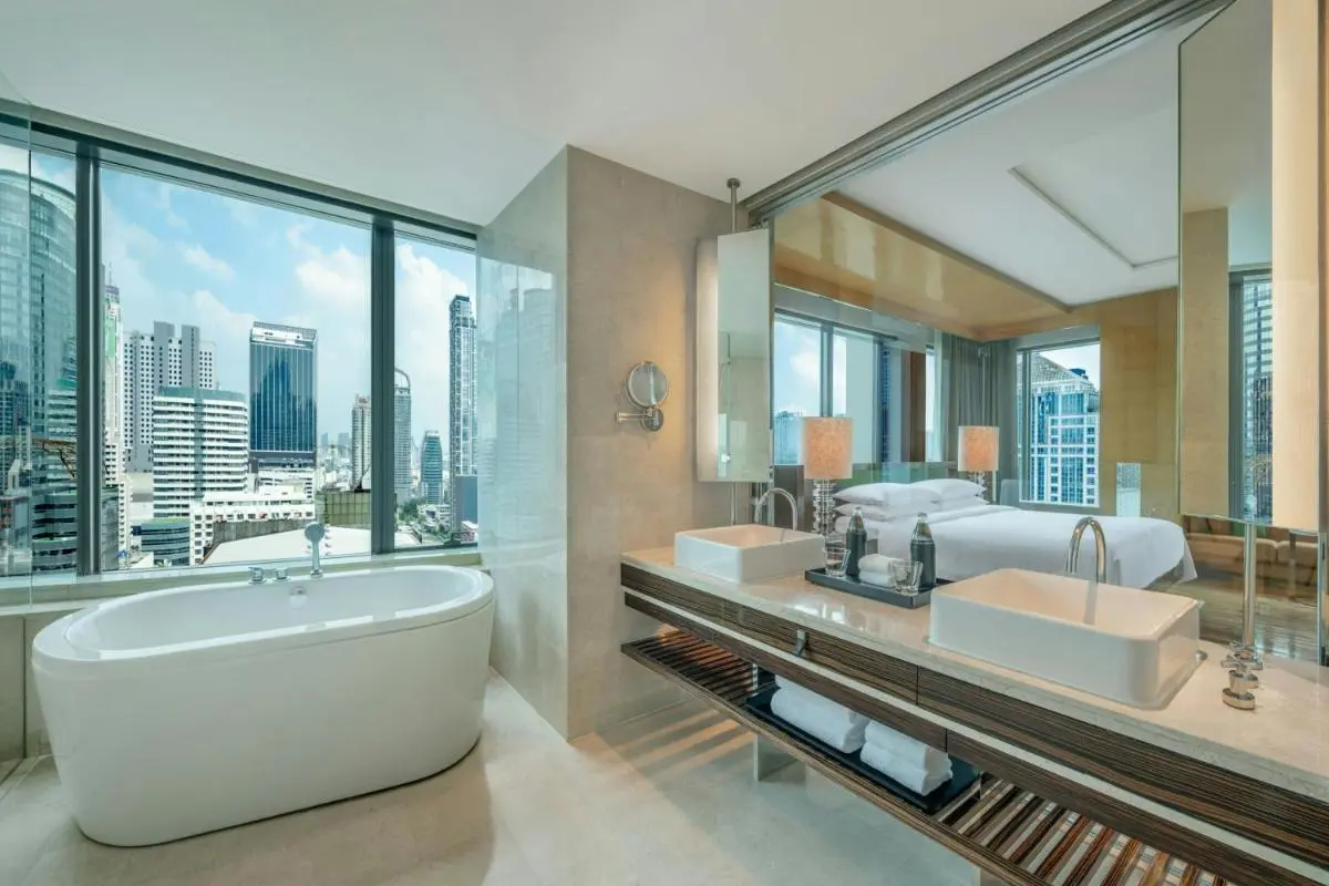 Modern Bathroom and Bedroom with Freestanding Tub and City Views in Pathumwan Bangkok