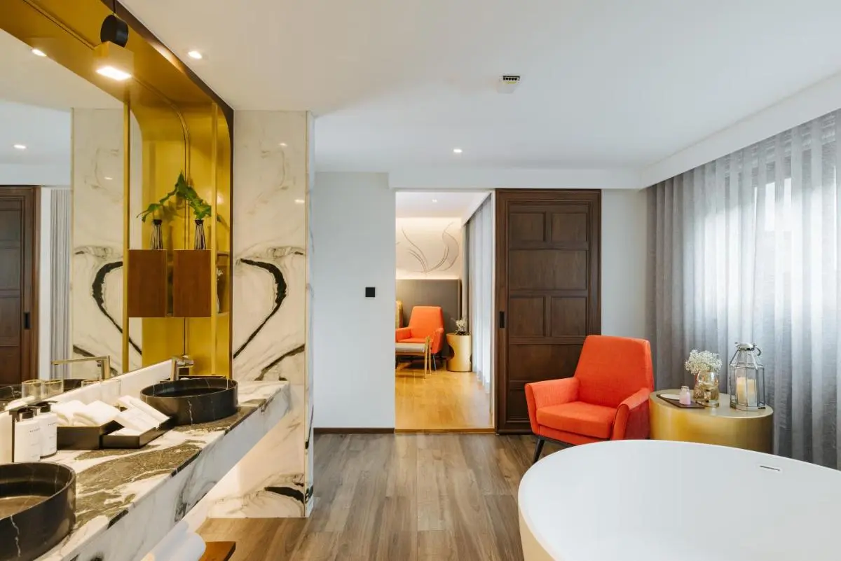Modern Bathroom and Wellness Area with Freestanding Tub and Marble Countertop in Chiang Mai