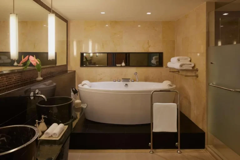 Modern Bathroom Design Featuring Freestanding Bathtub and Dual Sinks in Sathorn