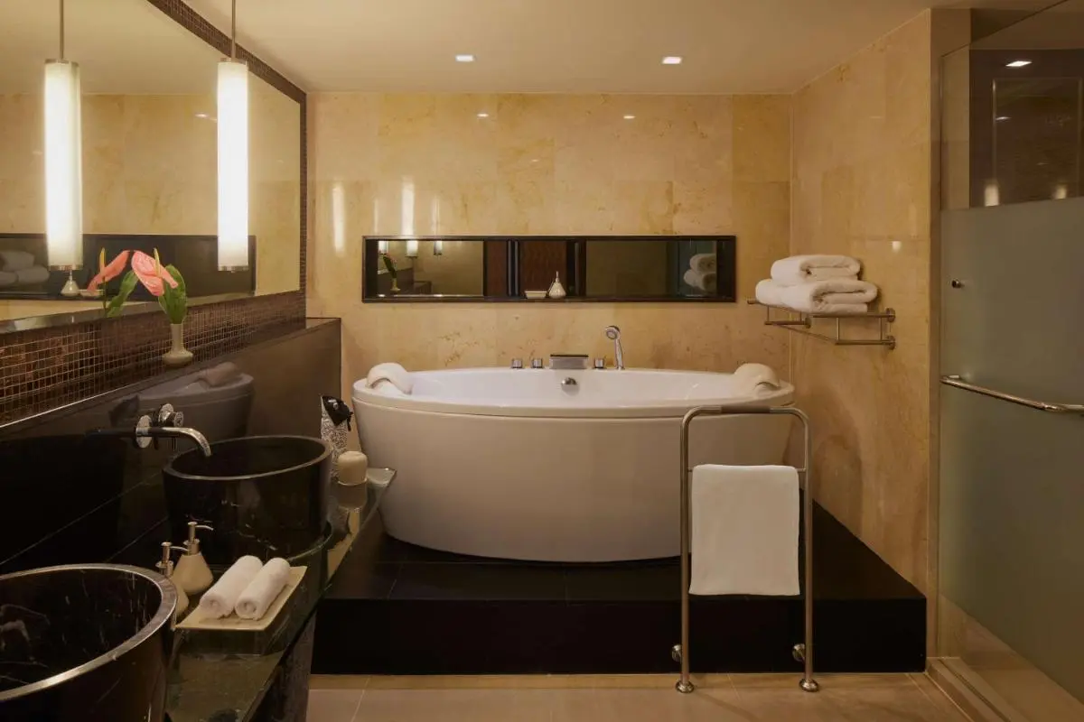 Modern Bathroom Design Featuring Freestanding Bathtub and Dual Sinks in Sathorn