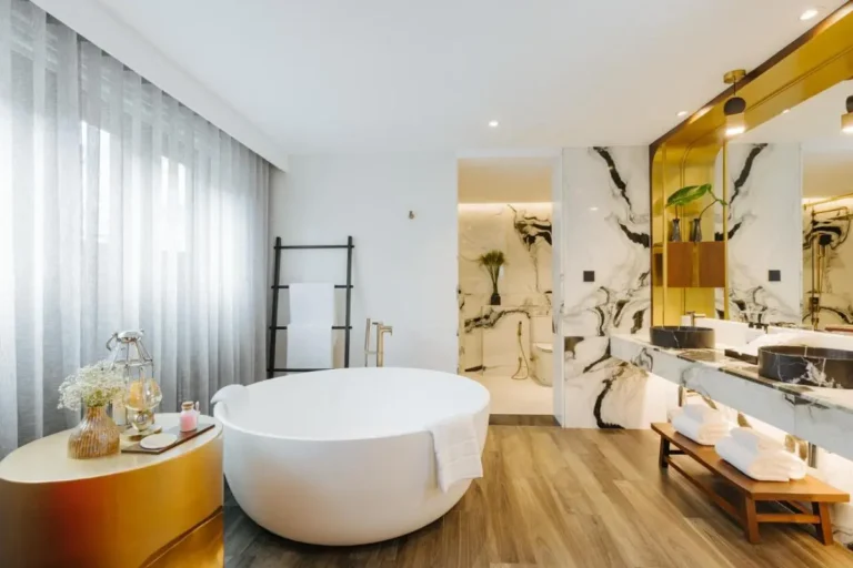 Modern Bathroom Design Featuring Freestanding Bathtub and Marble Vanity in Chiang Mai
