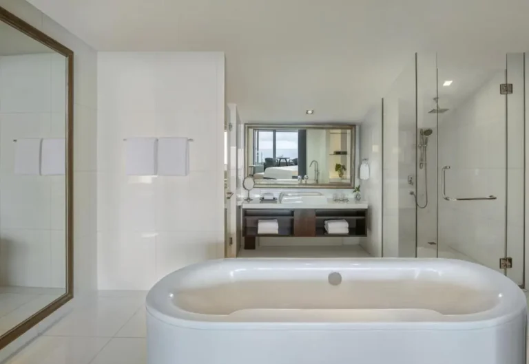Modern Bathroom Design Featuring Freestanding Oval Bathtub and Glass Shower Enclosure