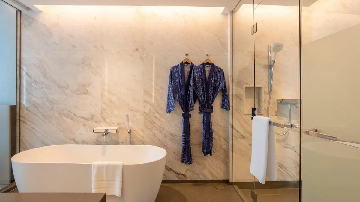 Modern Bathroom Design Featuring Freestanding Tub and Glass Shower in Ratchathewi